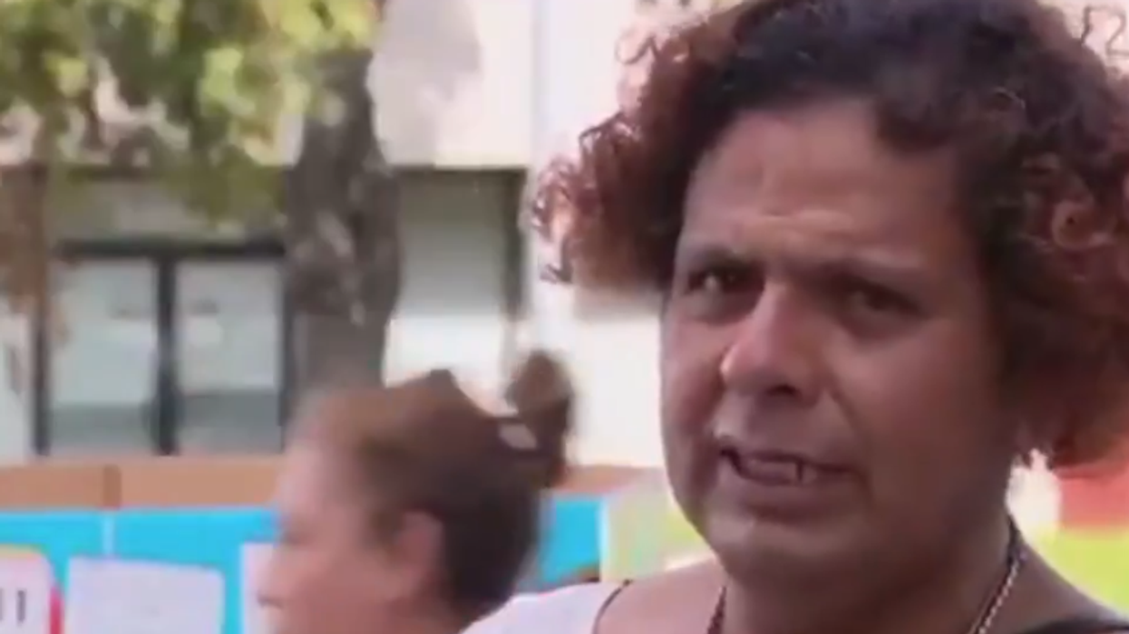 Trans Nicaraguan Refugee In Dress Is “Moved To Tears” Over Food Stamps Cut