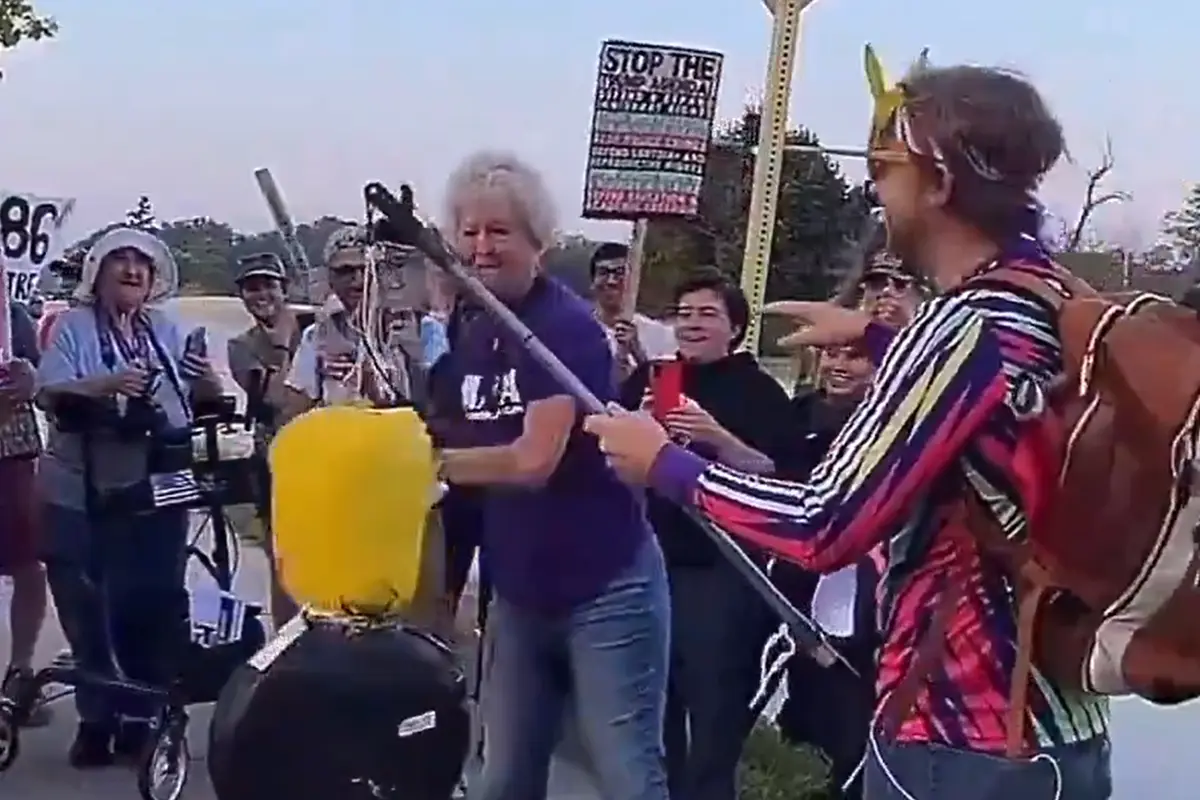 AWFL old lady tries to beat a Trump piñata while rocking a "kindness" t-shirt
