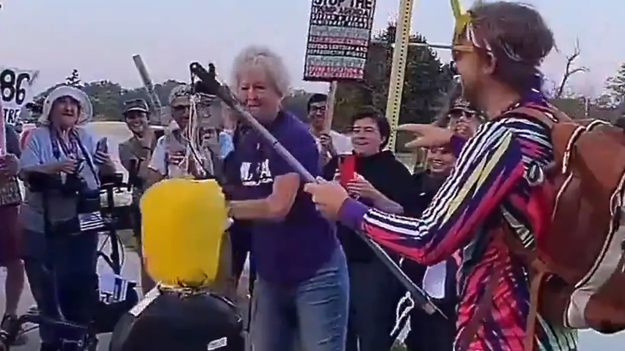 AWFL old lady tries to beat a Trump piñata while rocking a "kindness" t-shirt