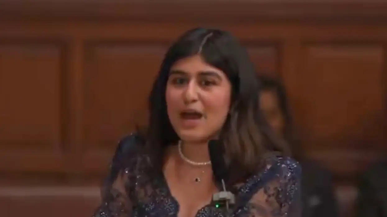 Palestinian activist tells Tommy Robinson he's lucky security is stopping rioters from murdering him as the crowd applauds