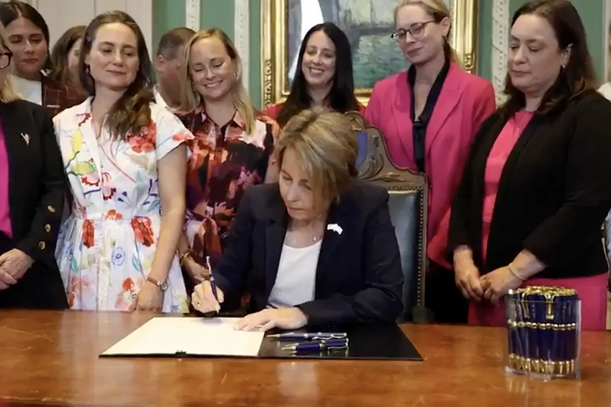 AWFL governor signs law legalizing all abortion until just before birth as other women cheer behind her