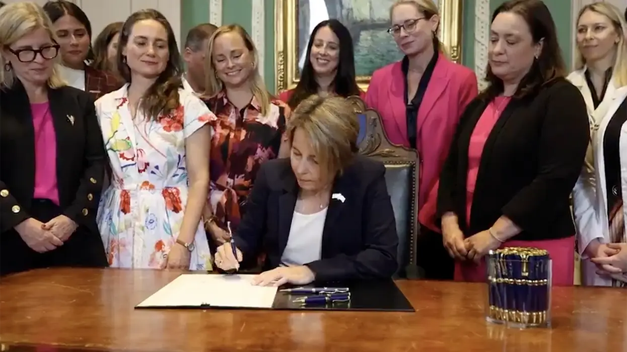 AWFL governor signs law legalizing all abortion until just before birth as other women cheer behind her