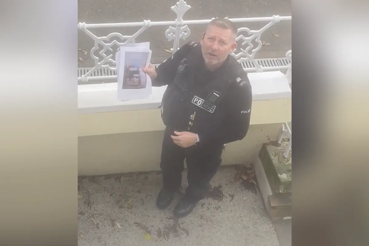 Police show up to harass woman over her social media post because OTHER PEOPLE are making "derogatory" memes about it