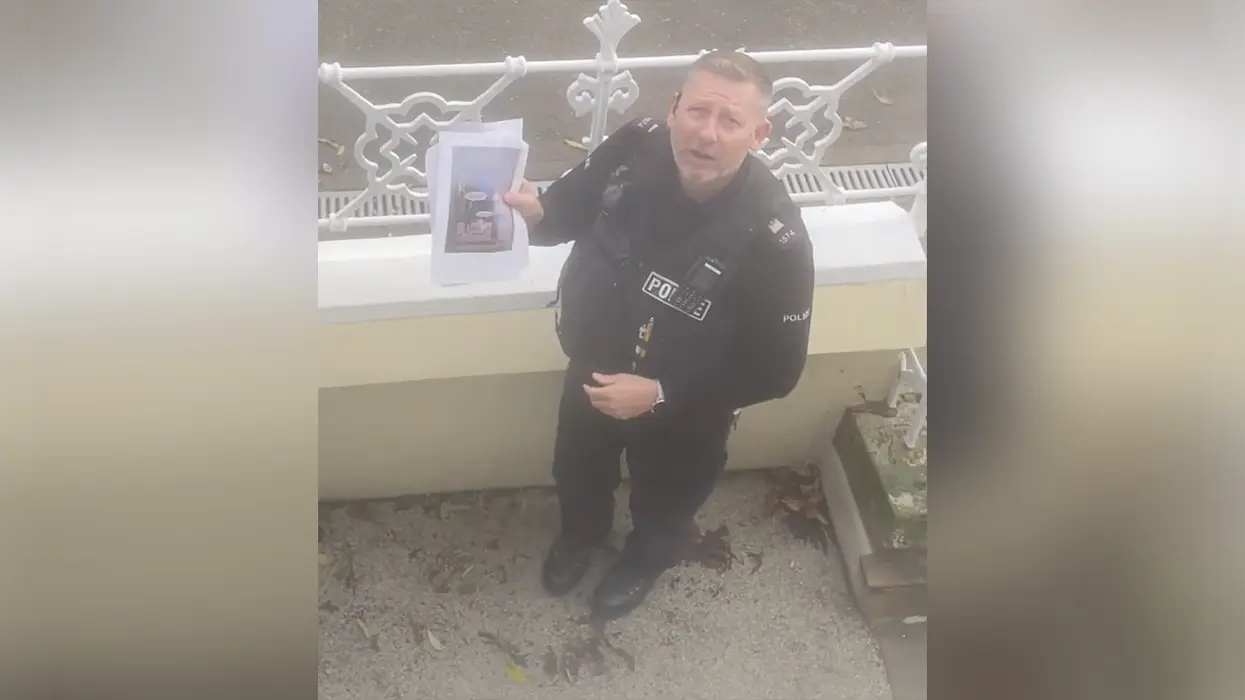 Police show up to harass woman over her social media post because OTHER PEOPLE are making "derogatory" memes about it